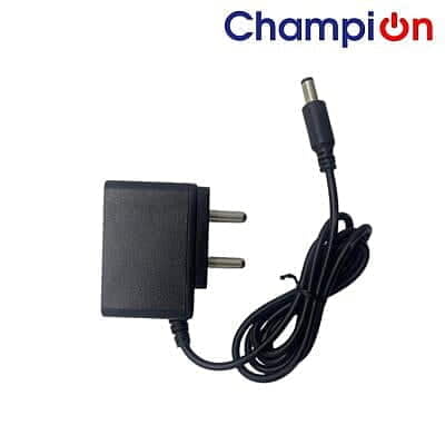 "Charger with a compact design, featuring a power cable and connector for charging electronic devices efficiently."